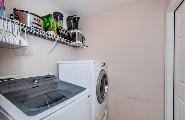 18186 Sandy Pointe Dr, Tampa, FL 33647 - laundry room with separate washer and dryer and laundry area