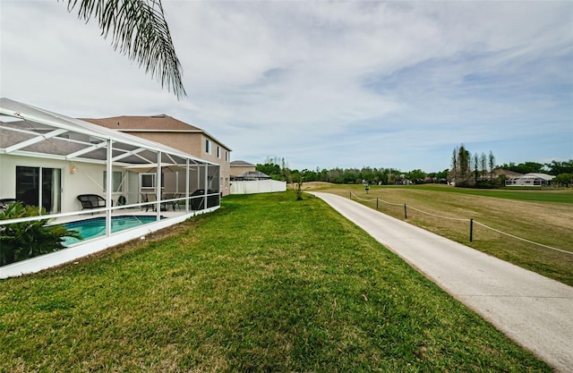 18186 Sandy Pointe Dr, Tampa, FL 33647 - view of yard featuring glass enclosure, an outdoor pool, and fence