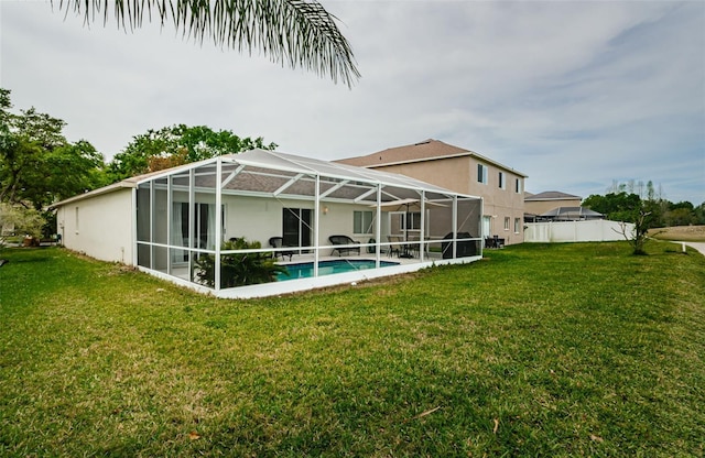 18186 Sandy Pointe Dr, Tampa, FL 33647 - rear view of house featuring an outdoor pool, glass enclosure, and a lawn