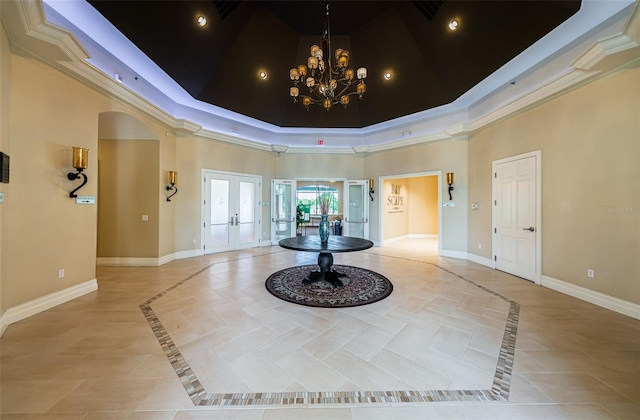 18186 Sandy Pointe Dr, Tampa, FL 33647 - interior space with a tray ceiling, french doors, baseboards, a towering ceiling, and visible vents