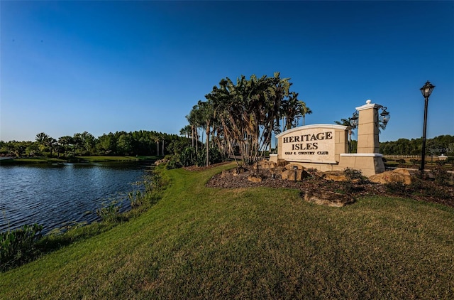 18186 Sandy Pointe Dr, Tampa, FL 33647 - community sign featuring a water view and a lawn