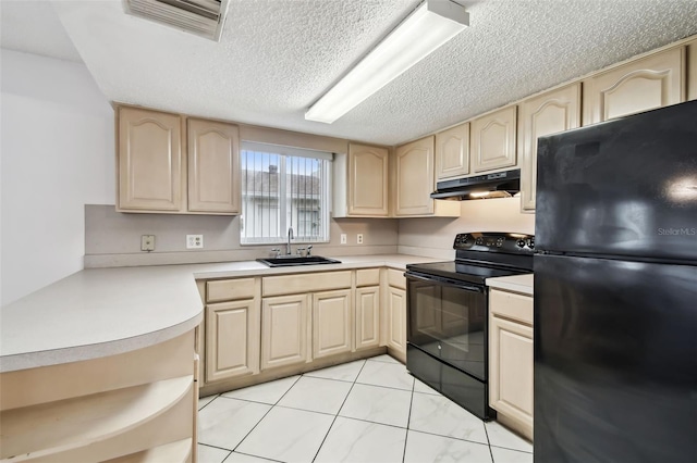 kitchen featuring under cabinet range hood, a sink, light countertops, light brown cabinetry, and black appliances