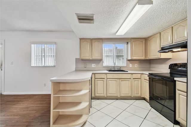 kitchen with visible vents, light countertops, under cabinet range hood, black range with electric cooktop, and open shelves