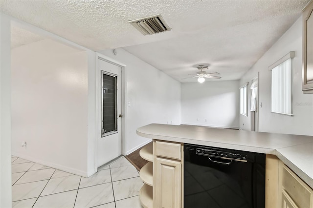 kitchen featuring black dishwasher, light countertops, visible vents, ceiling fan, and a textured ceiling