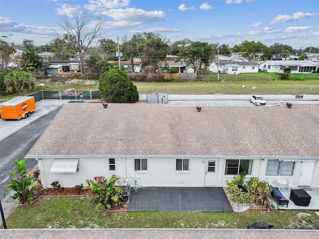 birds eye view of property with a residential view