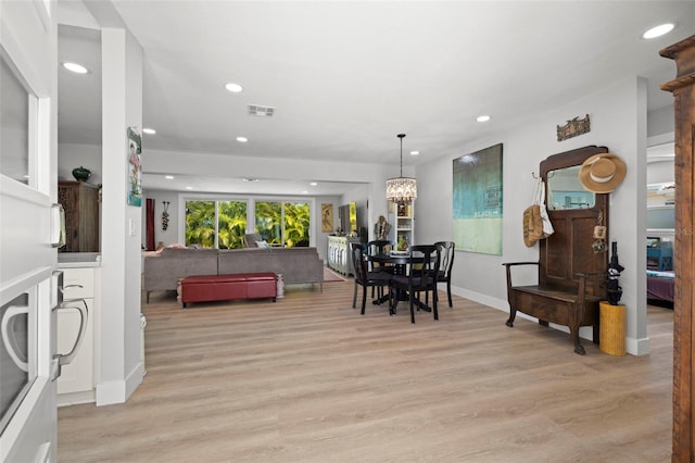 dining room featuring light wood-style flooring, visible vents, and recessed lighting