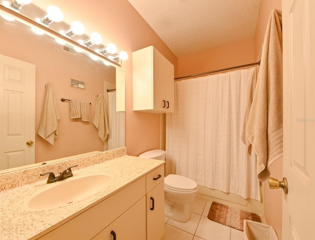 bathroom with visible vents, toilet, a textured ceiling, vanity, and tile patterned floors