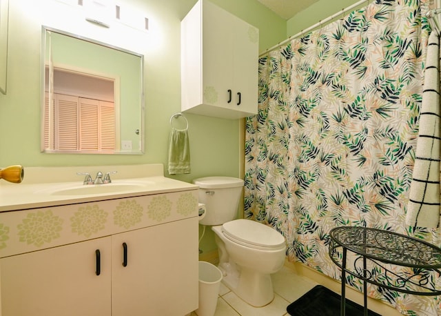 full bath featuring toilet, tile patterned flooring, and vanity