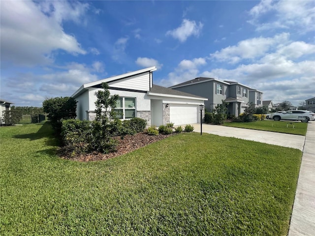 view of side of home featuring driveway, a lawn, stone siding, an attached garage, and stucco siding