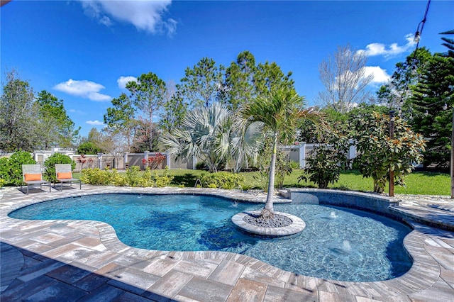 pool with fence and a patio