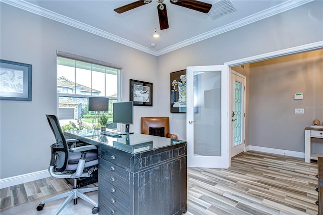 office space featuring ornamental molding, french doors, light wood-type flooring, and baseboards