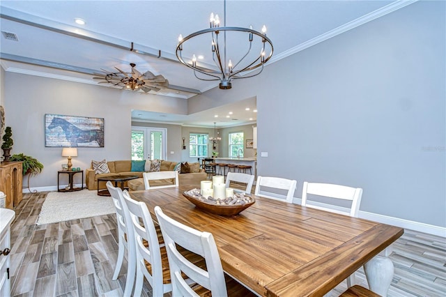 dining area with baseboards, ornamental molding, wood finished floors, and recessed lighting