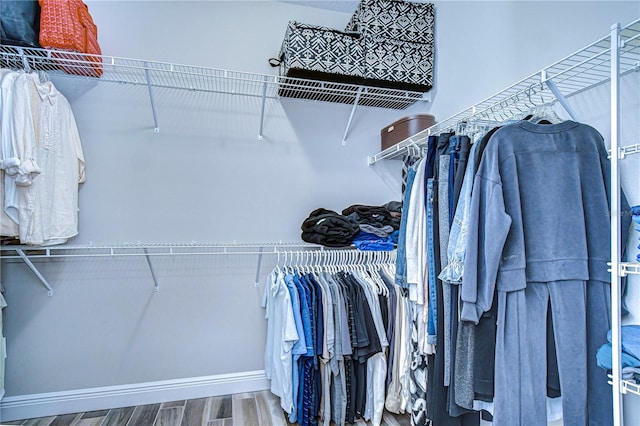 spacious closet with wood finished floors