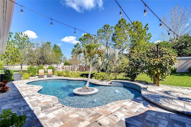 view of pool with a patio and fence