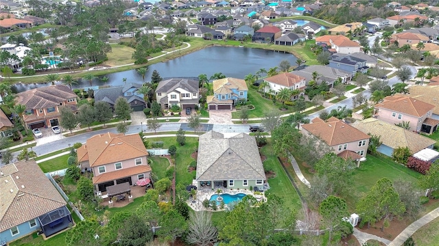 birds eye view of property featuring a water view and a residential view