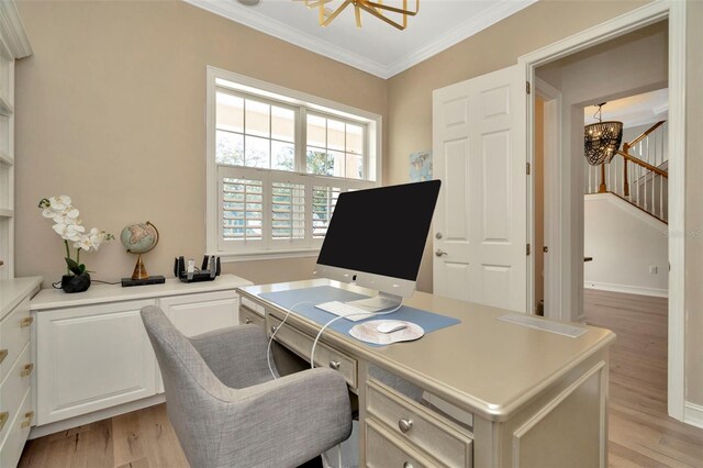 office space featuring ornamental molding, light wood-type flooring, a notable chandelier, and baseboards