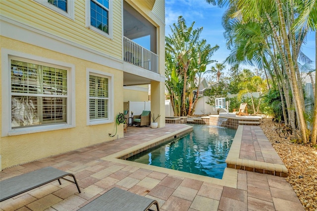 view of pool featuring a fenced in pool, a fenced backyard, and a patio