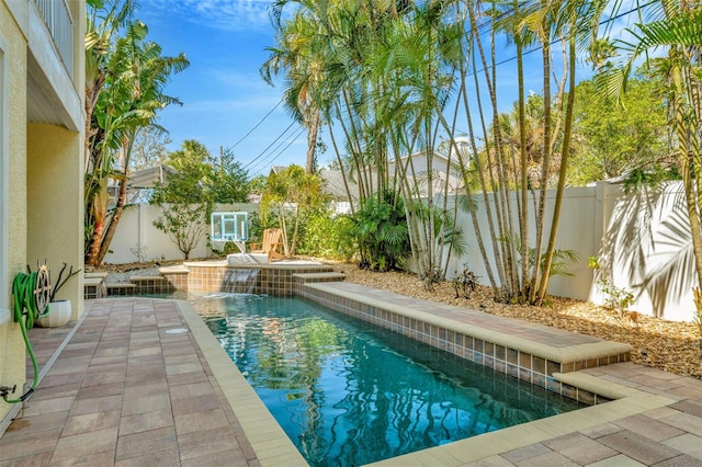 view of swimming pool featuring a patio area, a fenced backyard, and a fenced in pool