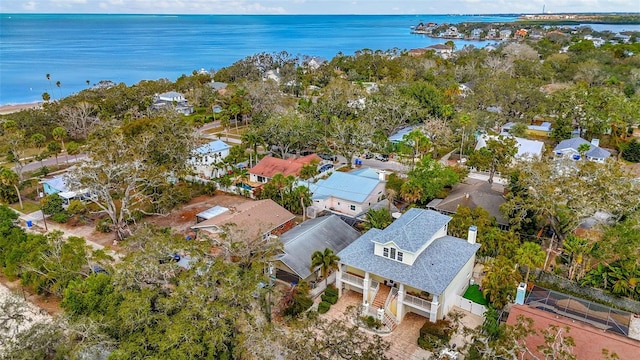 birds eye view of property with a water view and a residential view