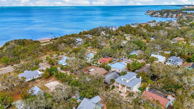 drone / aerial view with a water view and a residential view