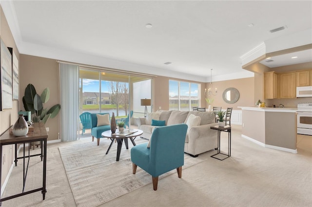 living room featuring visible vents, baseboards, a notable chandelier, and light colored carpet