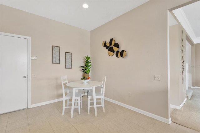 unfurnished dining area featuring tile patterned floors, recessed lighting, and baseboards