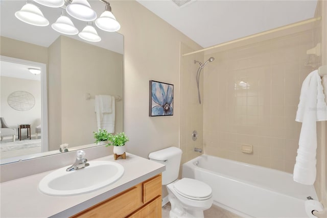 bathroom with vanity, toilet, and bathtub / shower combination