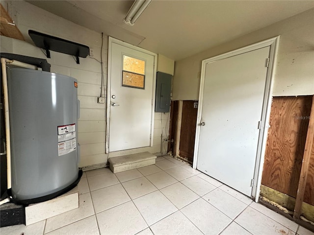 utility room with electric panel and water heater