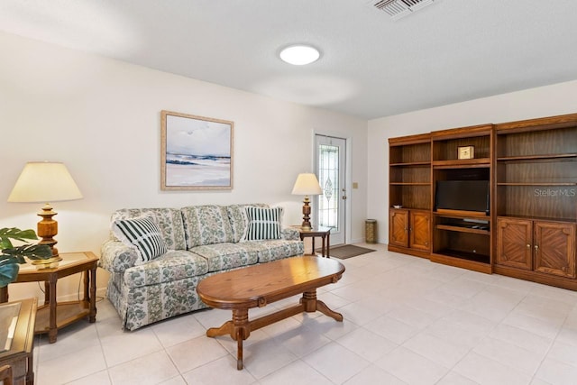 living room featuring visible vents