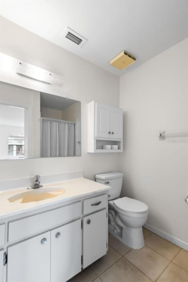 bathroom featuring visible vents, a shower with shower curtain, toilet, vanity, and tile patterned floors