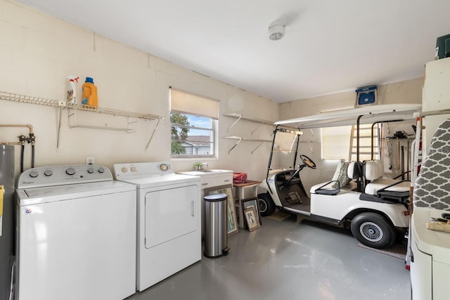 washroom featuring washer and dryer and laundry area