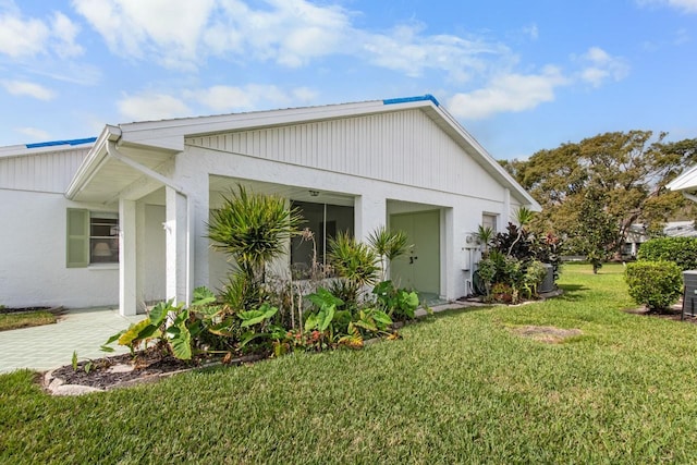 exterior space with a lawn