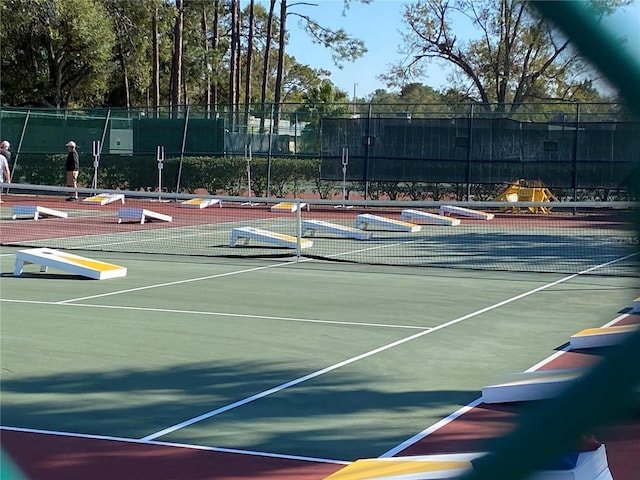 view of sport court with fence