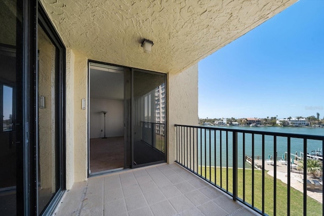 balcony featuring a water view