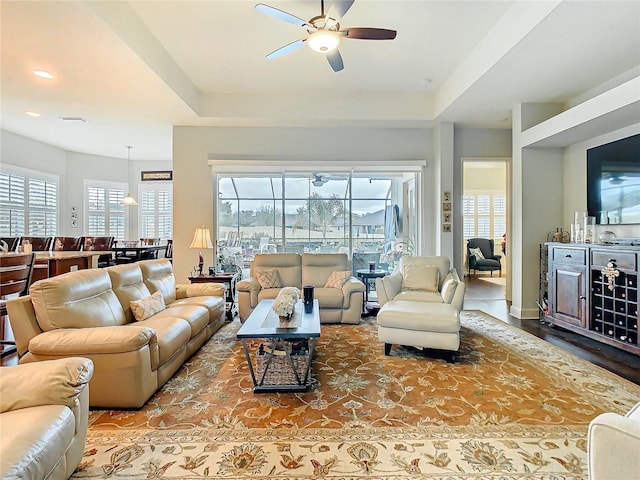 living area with ceiling fan and a wealth of natural light