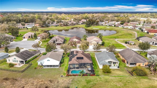 drone / aerial view with a residential view and a water view