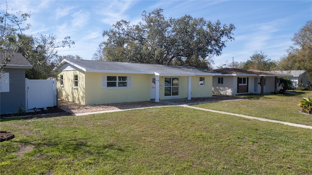 ranch-style house with a front yard