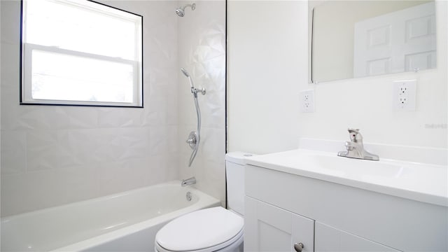 full bath with shower / tub combination, vanity, and toilet