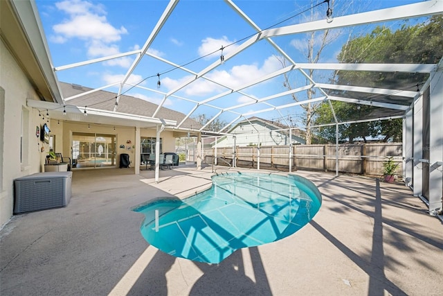 view of pool with a fenced in pool, a lanai, a fenced backyard, and a patio