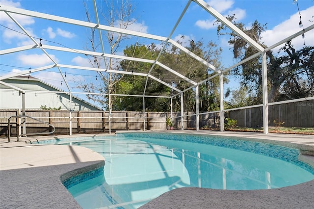 view of pool featuring a fenced in pool, a patio area, a lanai, and a fenced backyard