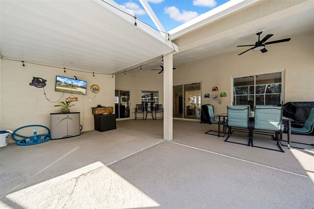 view of patio featuring a ceiling fan and outdoor dining space