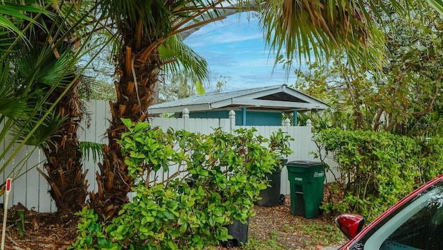 view of side of property featuring fence