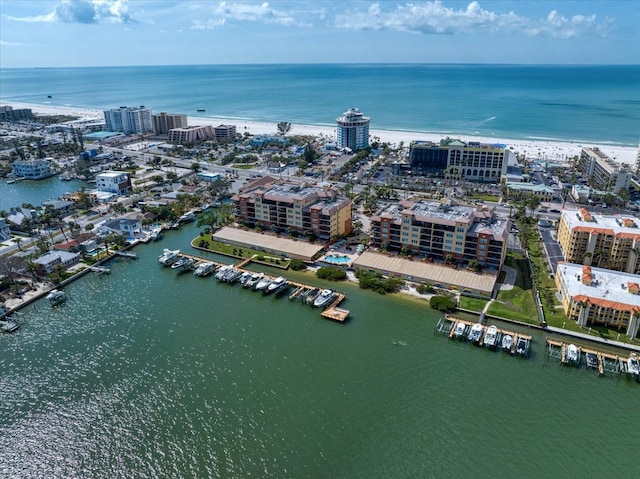 drone / aerial view featuring a view of city and a water view