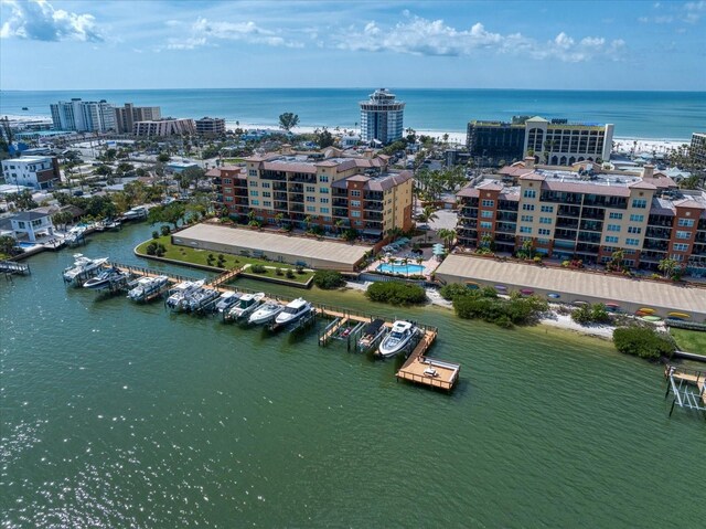 birds eye view of property with a water view and a city view