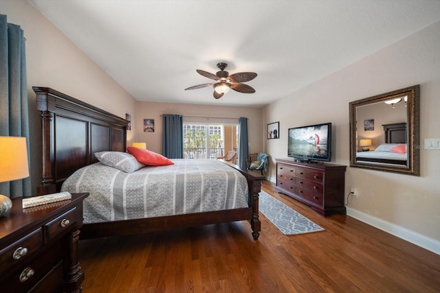 bedroom featuring access to outside, dark wood finished floors, a ceiling fan, and baseboards