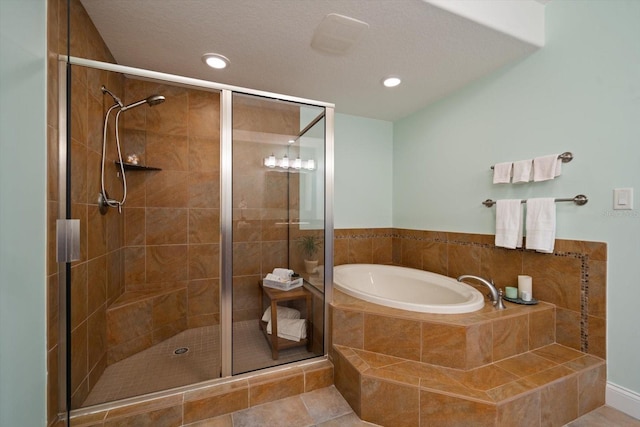 bathroom with tile patterned flooring, a shower stall, a bath, and recessed lighting