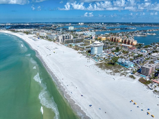 birds eye view of property with a water view, a city view, and a view of the beach