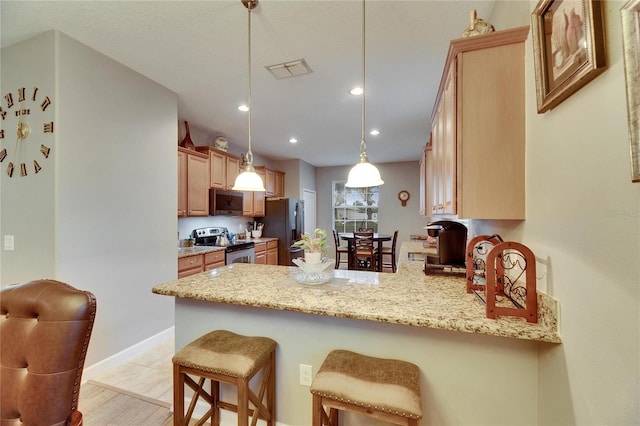 kitchen with visible vents, hanging light fixtures, light stone countertops, a peninsula, and stainless steel appliances