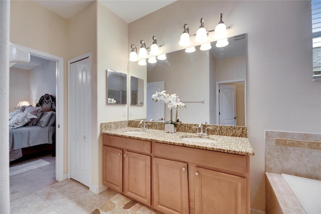 full bathroom featuring ensuite bath, a closet, and a sink