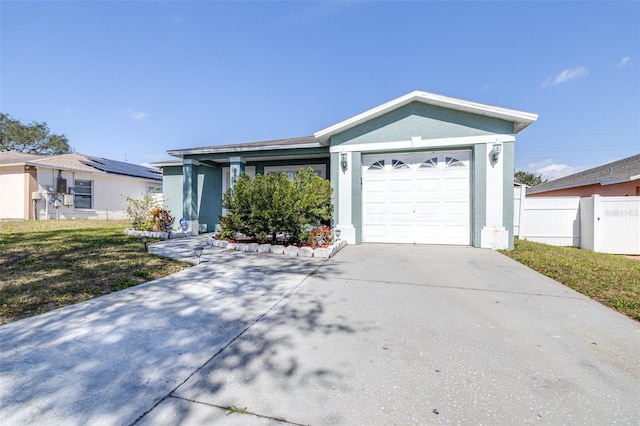 ranch-style house with stucco siding, concrete driveway, an attached garage, fence, and a front lawn